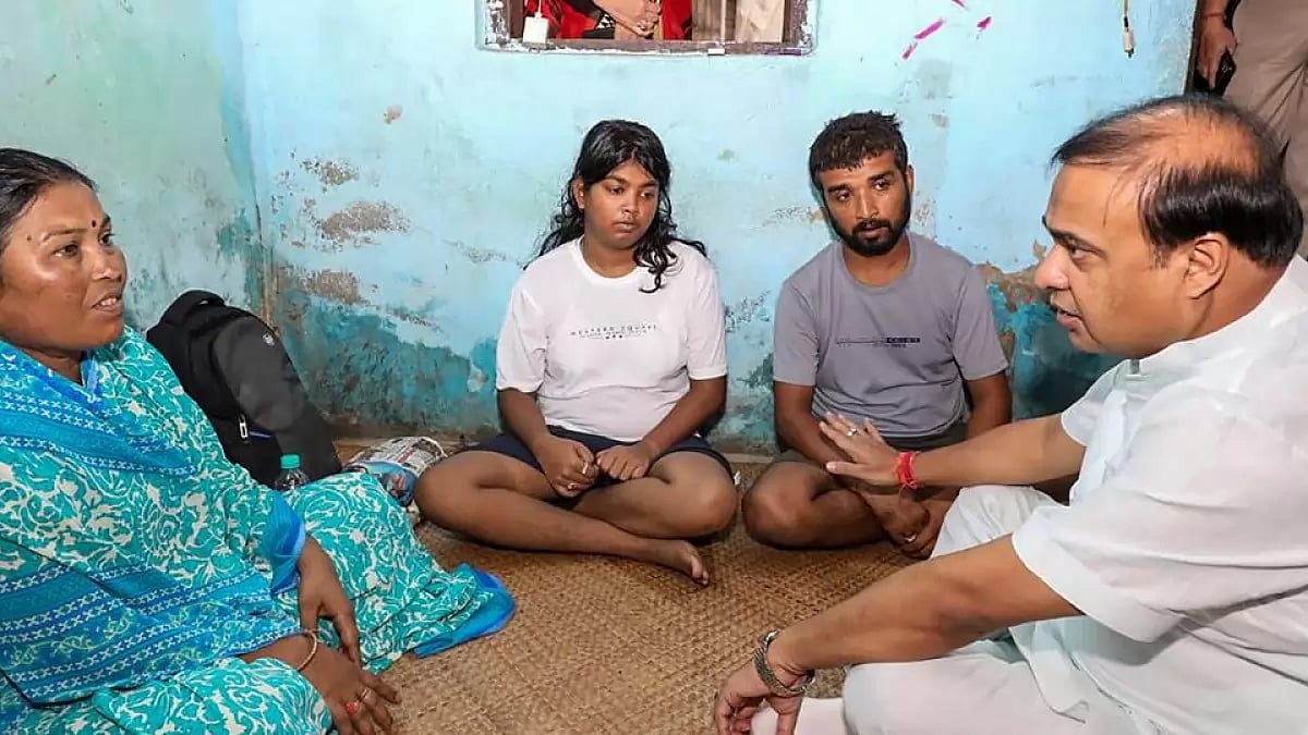Assam CM Hemant Biswa Sarma with the family members of the victims family-of the triple murder case.