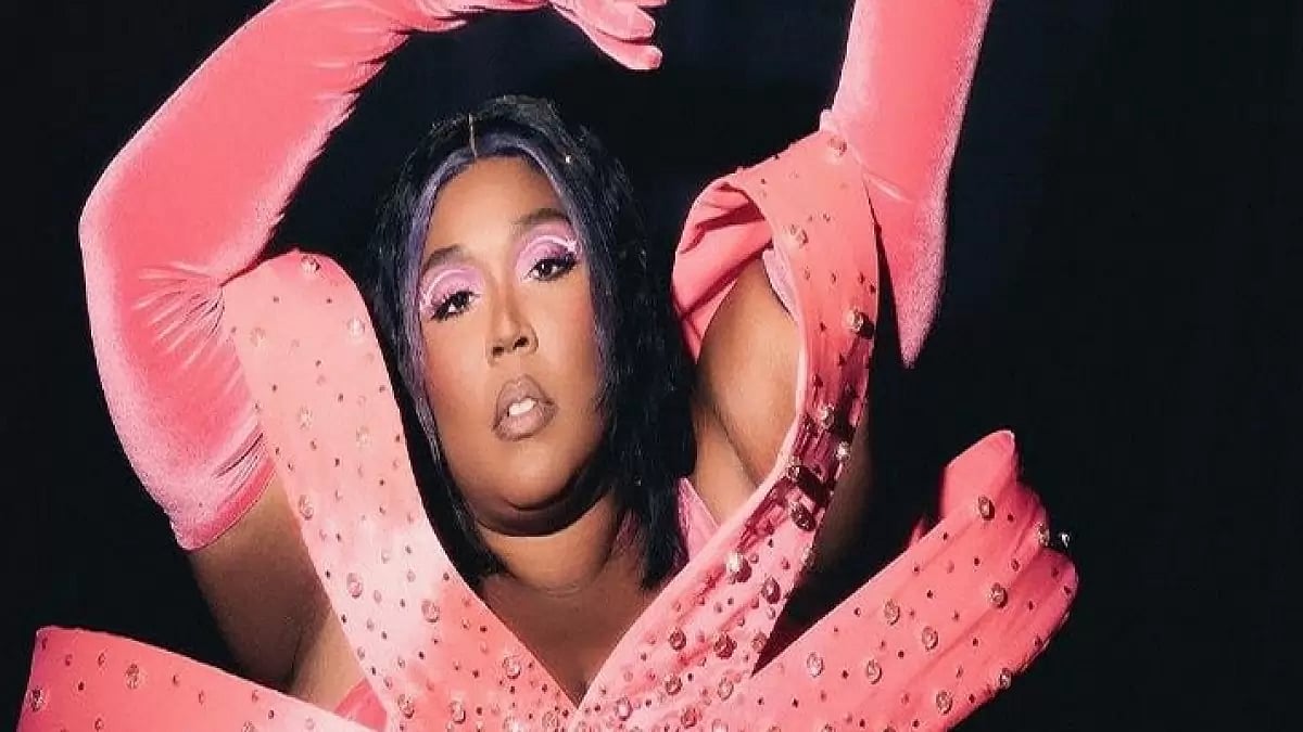 Lizzo performing on stage and posing for photographs