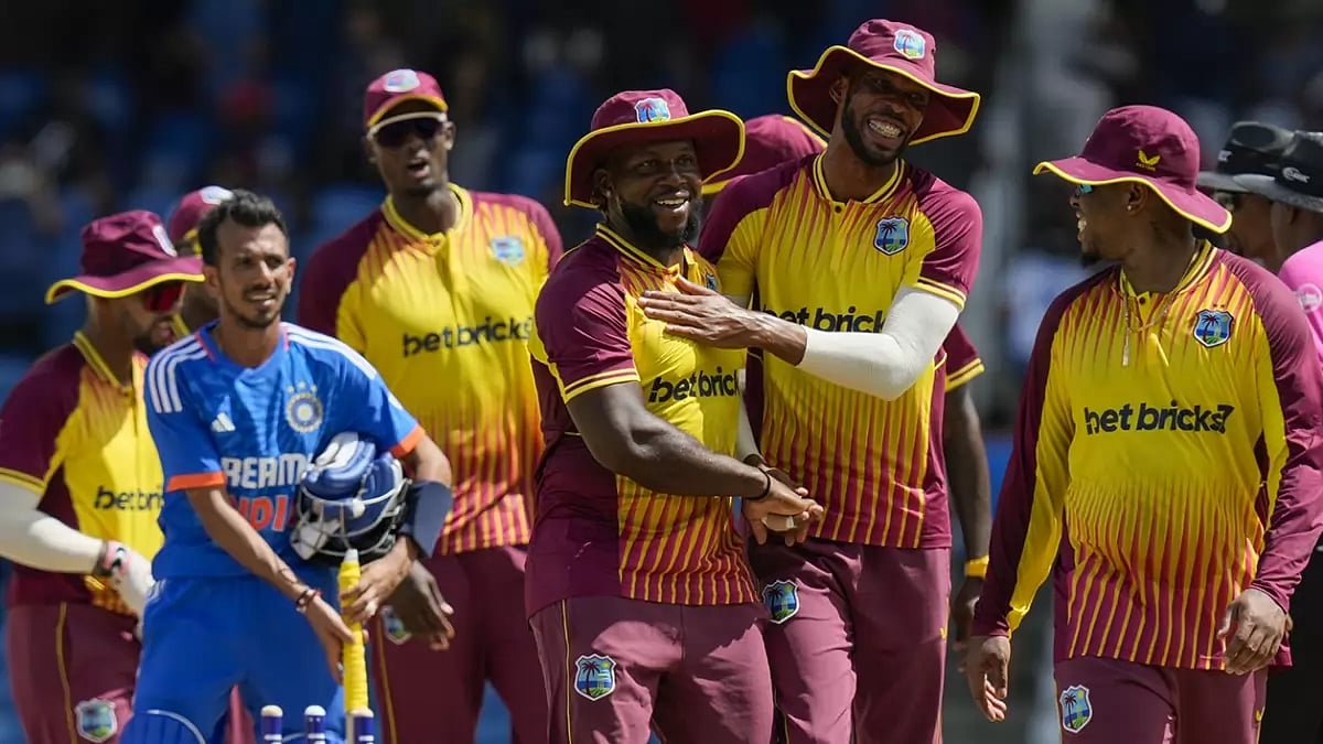 West Indies players celebrate after defeating India by 4 runs in the first T20I.
