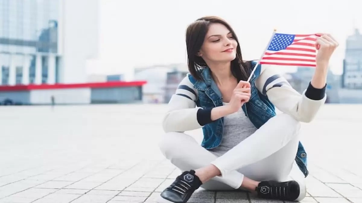 A woman holding American Flag 