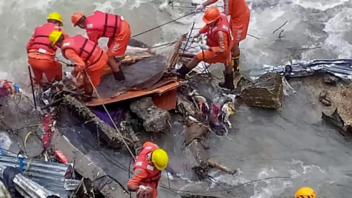 Rudraprayag: Rescuers pull out a body during a search operation after a landslide that occured on Aug 4, at Gauri Kund in Rudraprayag, Saturday, Aug. 12, 2023. 