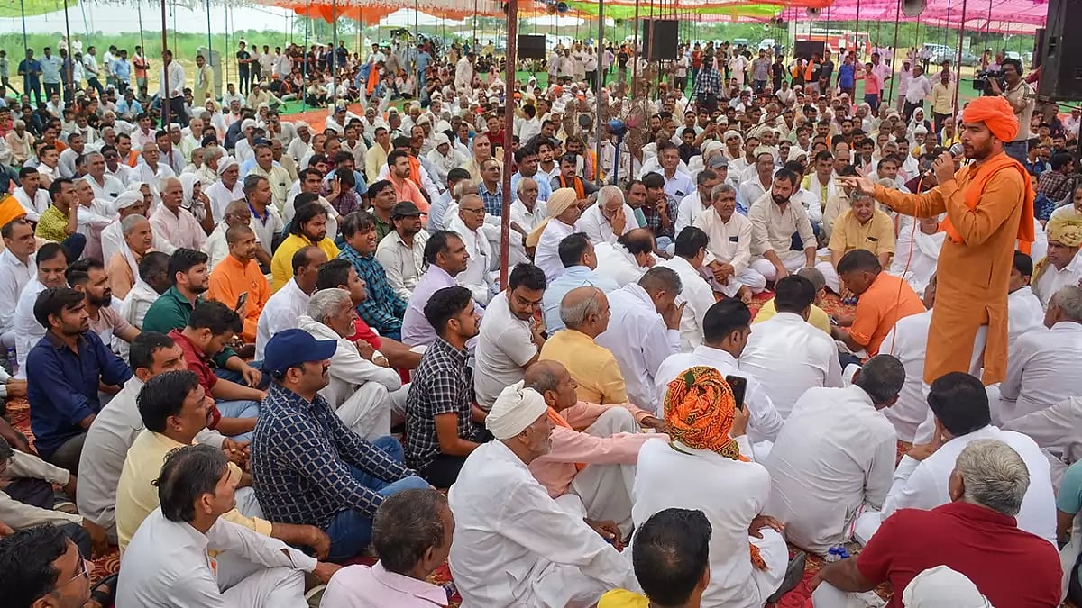 People attend a 'Mahapanchayat' called by Hindu outfits, at Pondri village in Palwal District. 