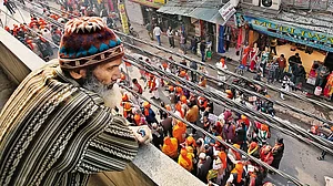 Countering Hate: A Muslim man watches a peace march staged by the Arya Samaj in Delhi