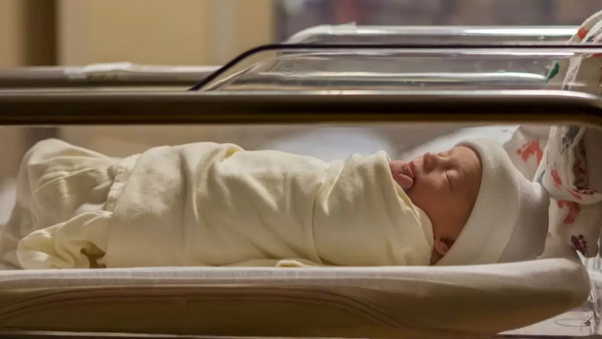 Representational image of a newborn in a baby crib