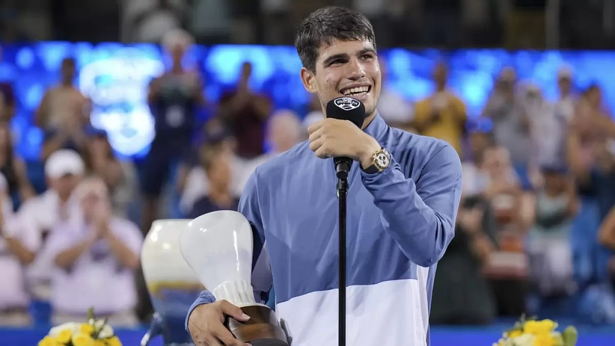 Carlos Alcaraz, of Spain, speaks to the crowd after being defeated by Novak Djokovic.