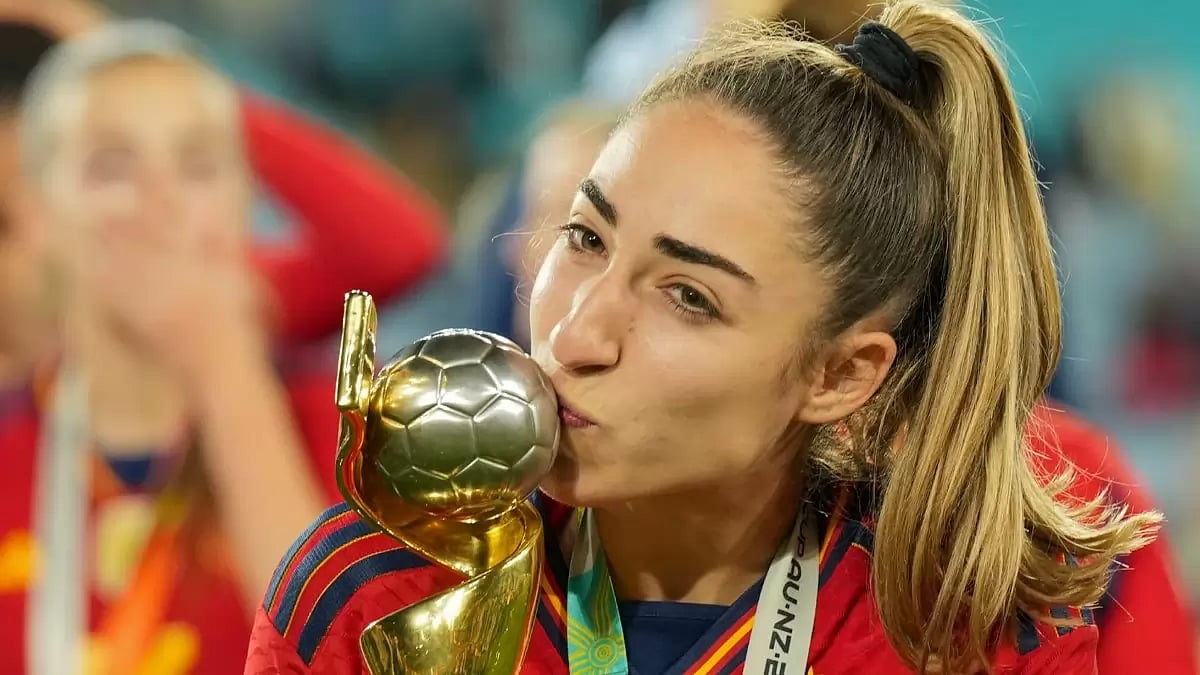Spain's scorer on the night, Olga Carmona with the trophy.