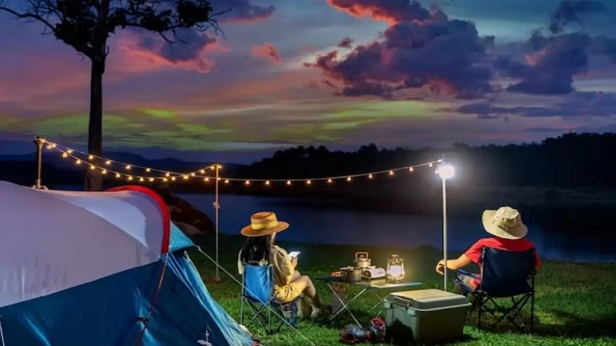 Couple enjoying camping by the lake