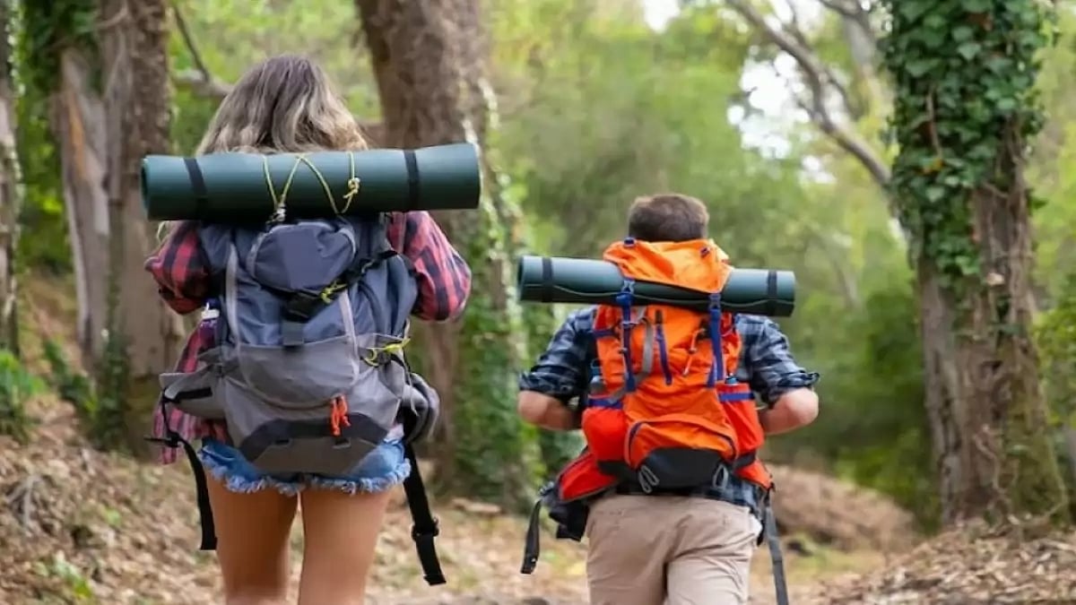 Backpackers walking on mountainous trail