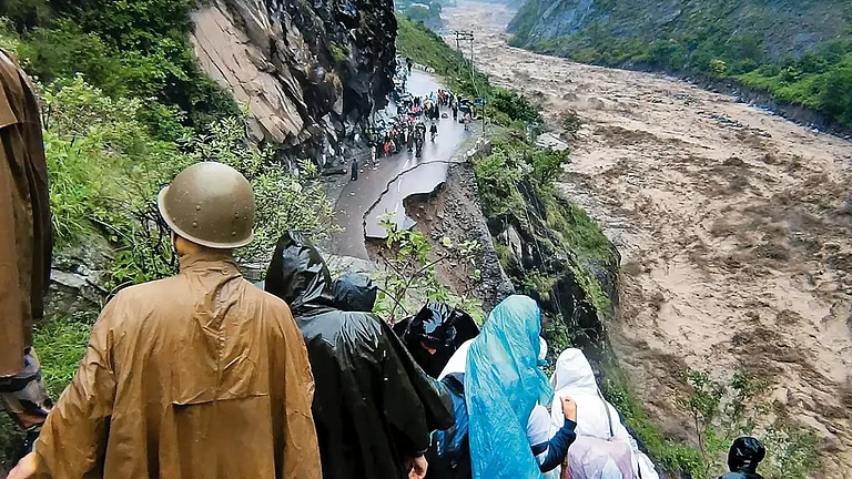 Nature’s Fury: Flooded river and collapsed road in Uttarakhand - null