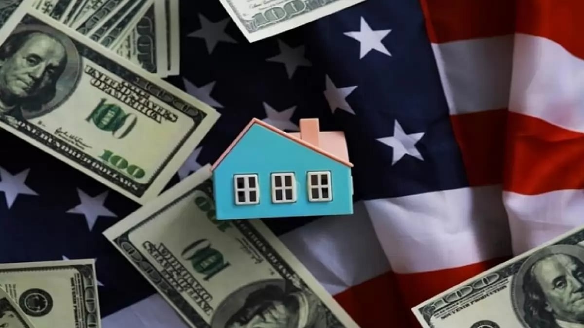 House miniature with American flag and currency.