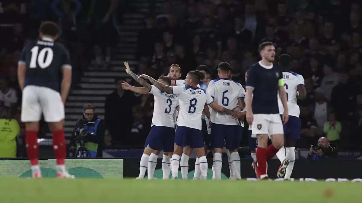 England players celebrate a goal against Scotland at Hampden Park,