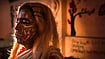 A Jatra performer waits to go onstage during an outdoor performance in Kolkata.