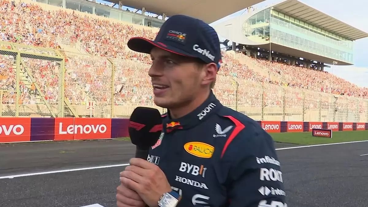 Red Bull driver Max Verstappen speaking to the crowd after grabbing pole