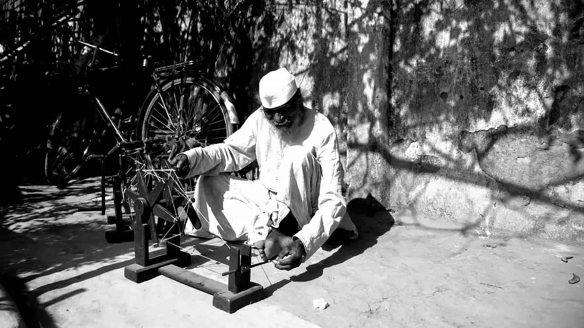 A Tana Bhagat with a Gandhian charkha