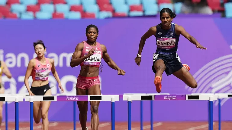 Vithya Ramraj (R) in action during her 400m hurdles heat in Hangzhou on Monday. - null