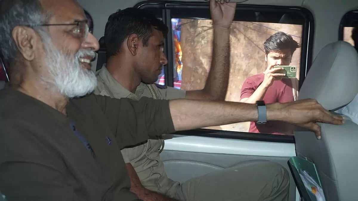 Founder and Editor-in-Chief of NewsClick Prabir Purkayastha is brought to Delhi Police Special Cell in New Delhi. Police raided the offices of the news website thats under investigation for allegedly receiving funds from China, as well as the homes of several of its journalists, in what critics described as an attack on one of Indias few remaining independent news outlets.