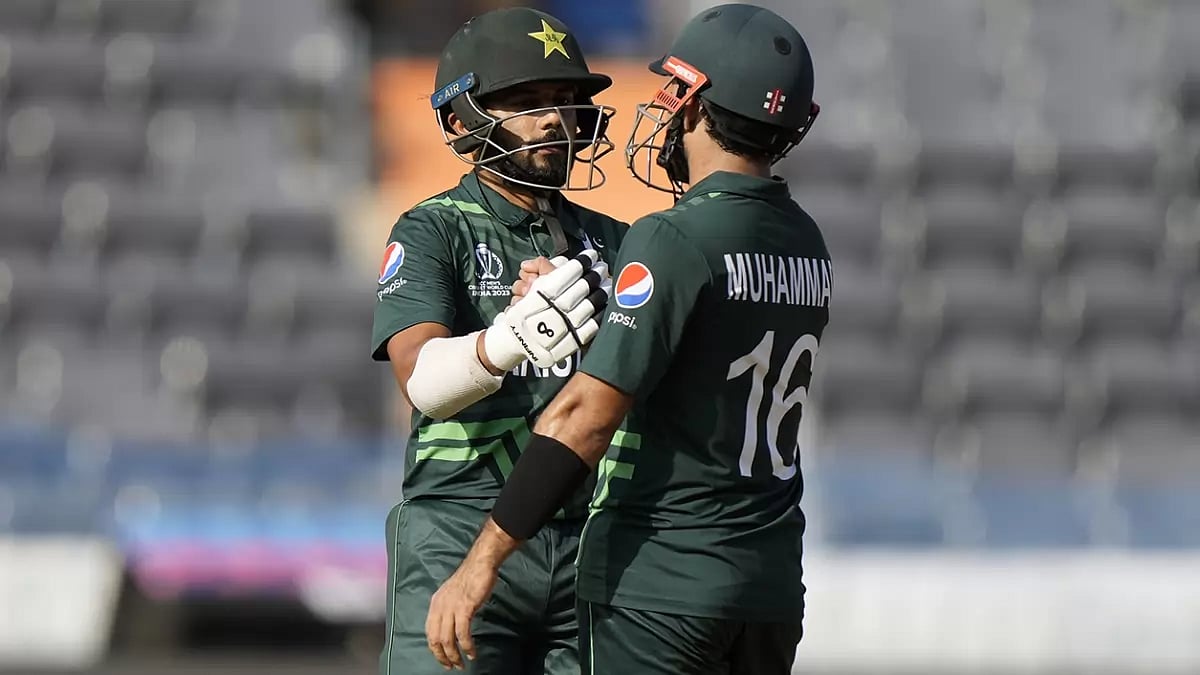 Pakistan's Saud Shakeel, left, with teammate Mohammad Rizwan in their CWC fixture