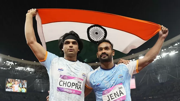 Neeraj Chopra (left) with Kishore Jena at the 19th Asian Games - null