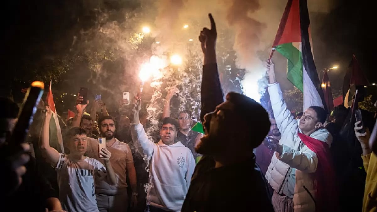 People gather in support of the recent attacks on Israel by the Palestinian militant group Hamas