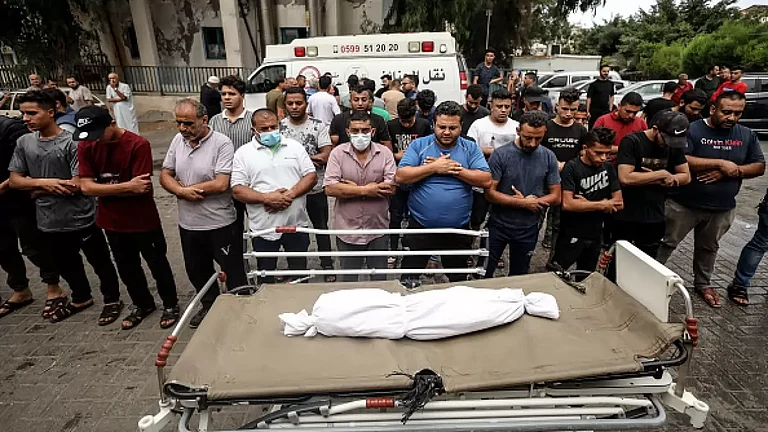 People gather at Shifa Hospital to pay tribute to a boy killed in Israeli strikes in Gaza - null