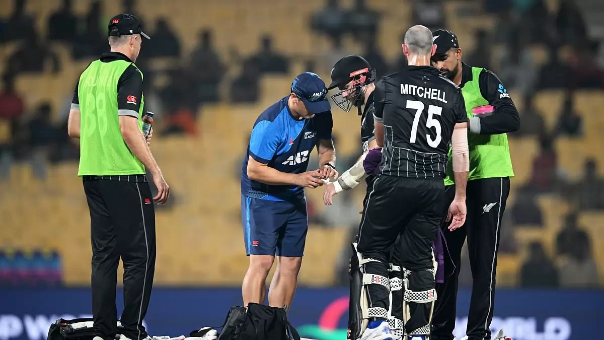 Kane Williamson (third from left) receives treatment during the NZ vs BAN match in Chennai.
