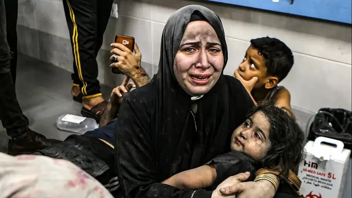 Civilians in distress in Gaza after a deadly airstrike on a hospital