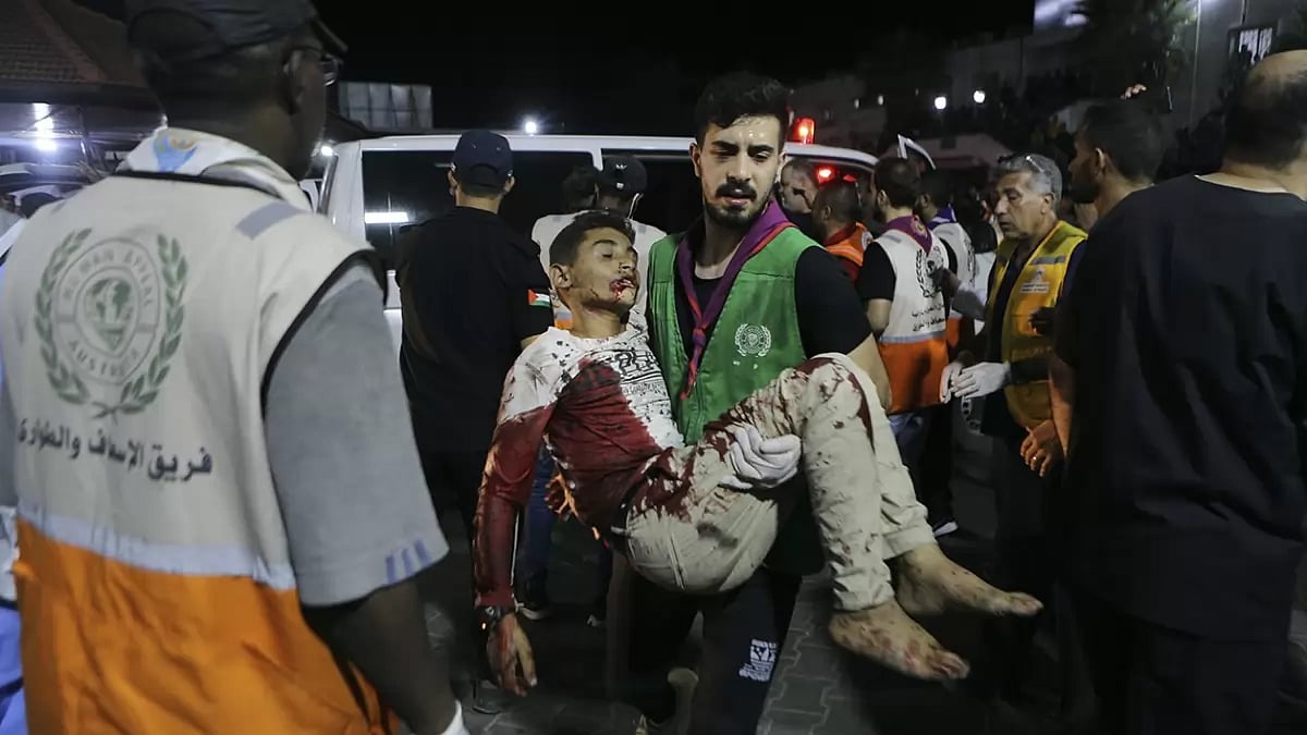 Wounded Palestinians arrive to al-Shifa hospital in Gaza City