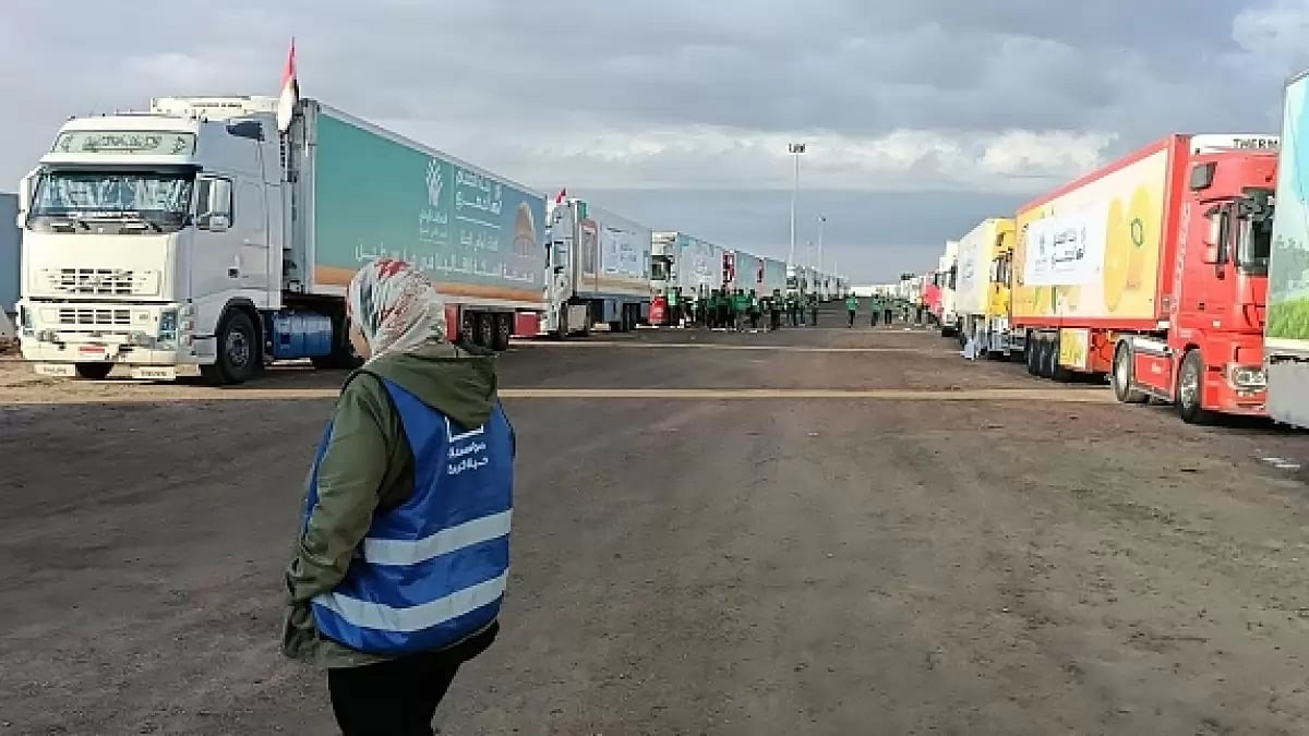 Trucks loaded with humanitarian aid supplies are seen at the Rafah crossing