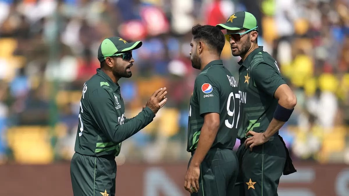 Pakistan captain Babar Azam speaking with fast bowler Haris Rauf in Bengaluru.