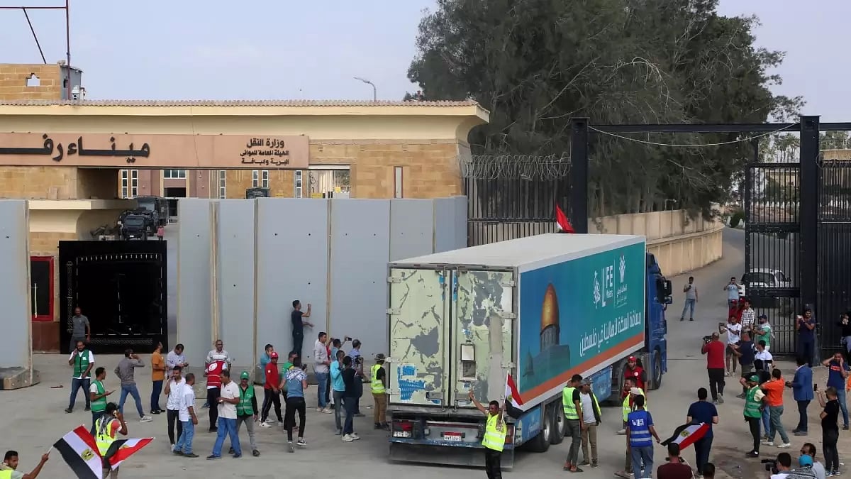 A truck carrying humanitarian aid for the Gaza Strip crosses the Rafah border gate in Rafah, Egypt, 