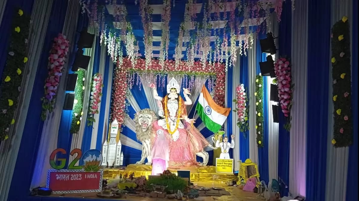 An idol of Goddess Durga holding the national flag in Patna