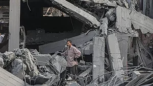 Civil defense teams and residents conduct search and rescue operations in Gaza