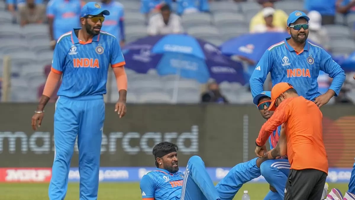 Hardik Pandya (2nd from left) gets treatment during the India vs Bangladesh game in Pune.