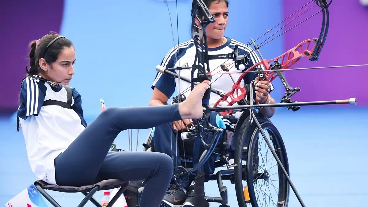 Sheetal Devi (left) in archery action