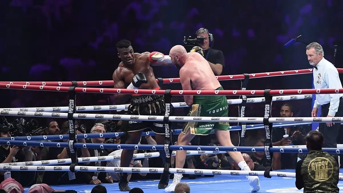 Tyson Fury, the WBC and lineal heavyweight champion (r), fights Francis Ngannou, of Cameroon - null