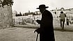 Caught in the Crossfire: An elderly Jewish man walks in Jerusalem