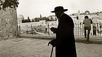 Caught in the Crossfire: An elderly Jewish man walks in Jerusalem