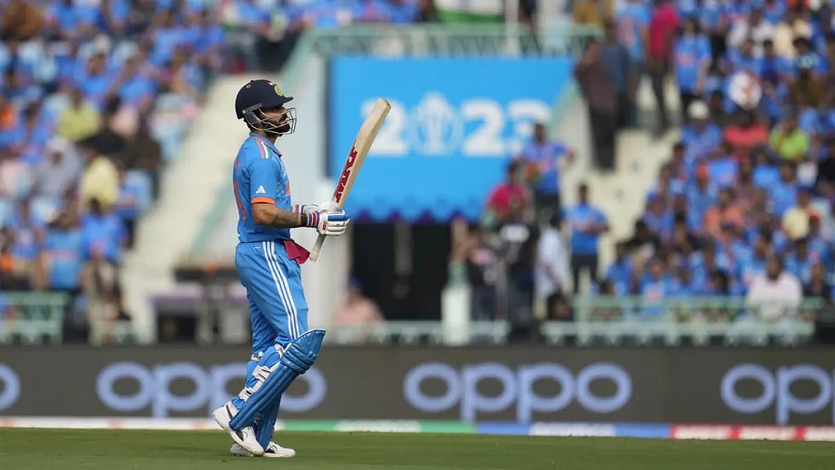 Virat Kohli walks back after being dismissed for a duck in Lucknow.