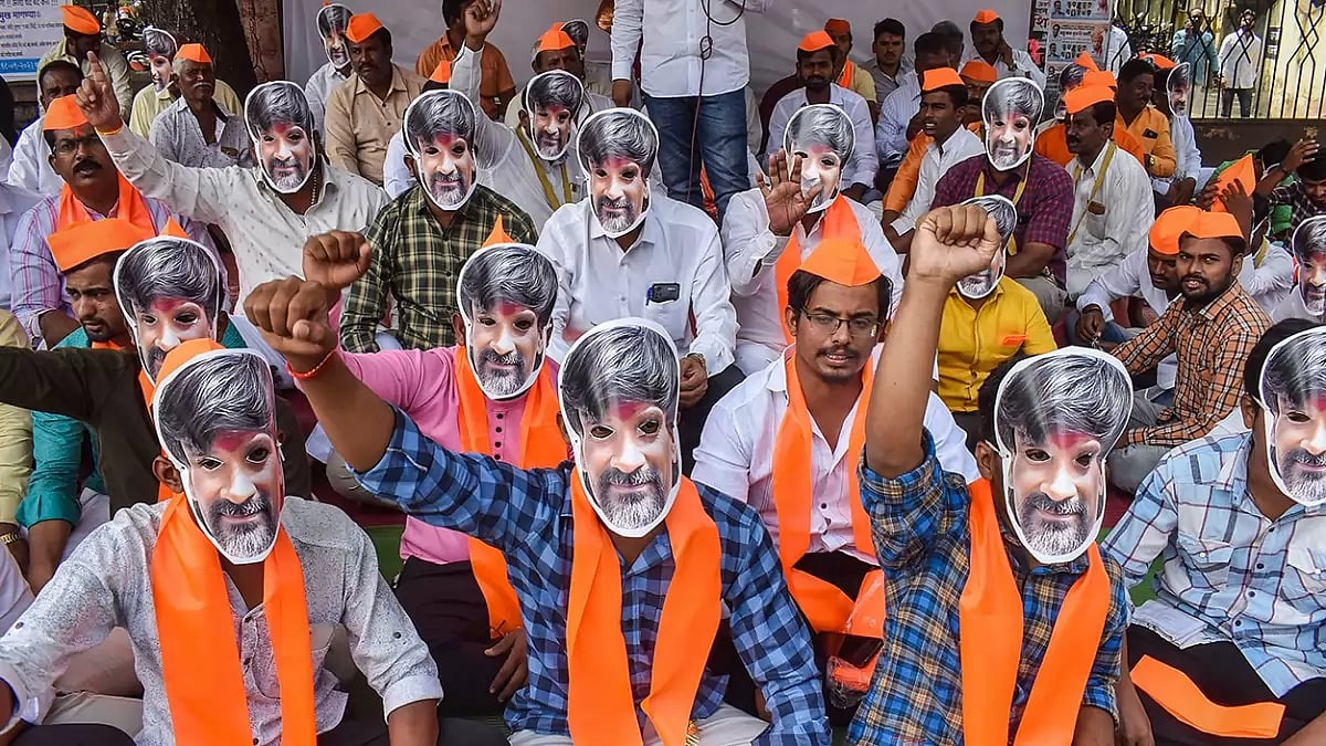 Sakal Maratha Samaj activists wearing mask of activist Manoj Jarange-Patil participate in a hunger strike to press for Maratha reservation, in Solapur.