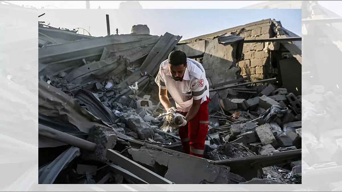 People search through buildings, destroyed during Israeli air raids in the southern Gaza Strip