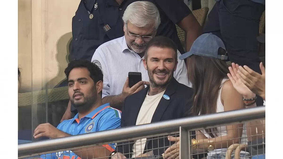 Former soccer star David Beckham talks to Bollywood actor Kira Adani as Akash Ambani watches during the ICC Mens Cricket World Cup first semifinal match between India and New Zealand in Mumbai.