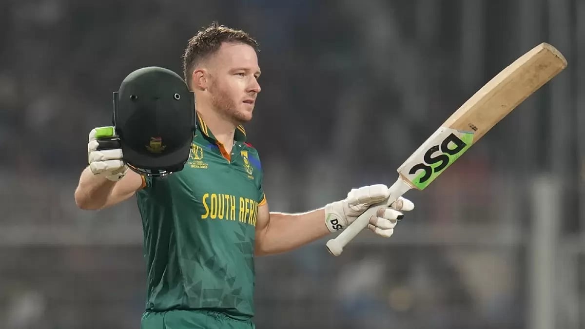 David Miller raises his bat after completing his ton