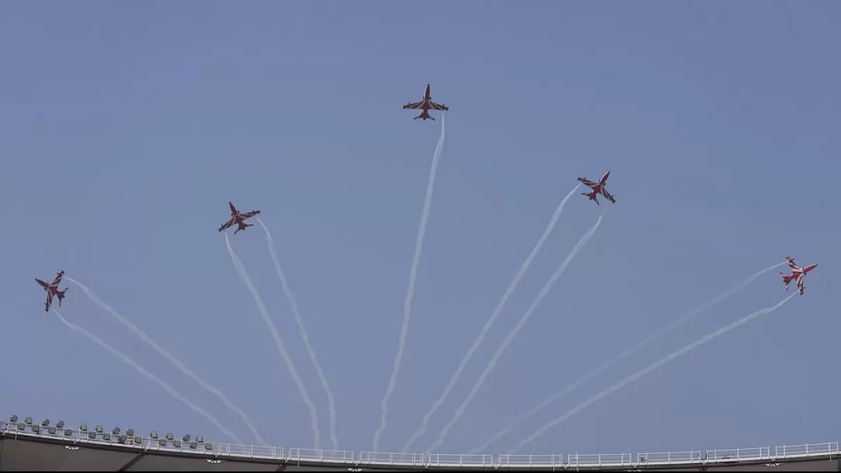 The Surya Kiran team of the Indian Air Force performs an aerobatic display ahead of the final 