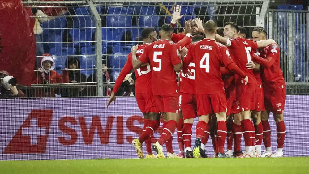 Switzerland's players cheer against Kosovo during the European Championship 2024 Qualifiers