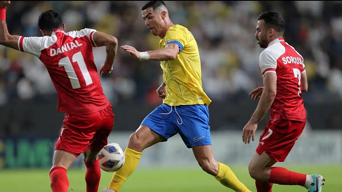 Cristiano Ronaldo (C) in action in the AFC Champions League game between Al-Nassr and Persepolis.