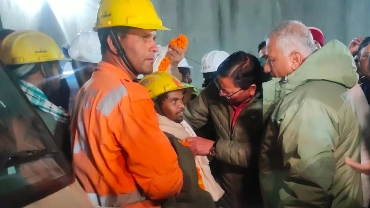 Uttarakhand CM Pushkar Singh Dhami with first labourer evacuated from Silkyara tunnel in Uttarkashi district