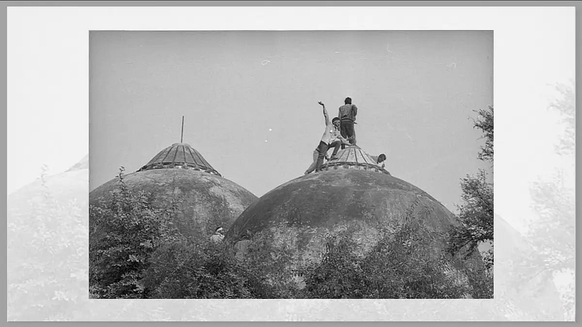 Karsevaks atop the Babri masjid shortly before it was demolished on December 6, 1992, at Ayodhya.