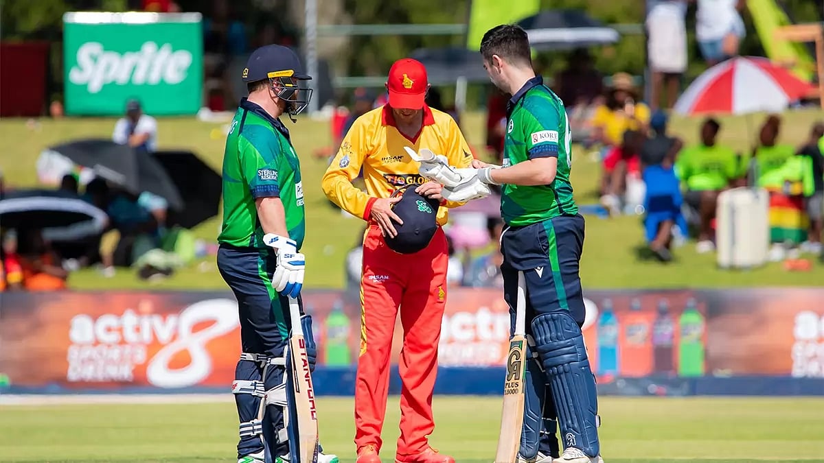 Sean Williams helping Andrew Balbirnie with his helmet during 2nd T20I