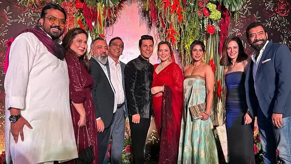 Mona Singh congratulats Lin Laishram and Randeep Hooda at their reception