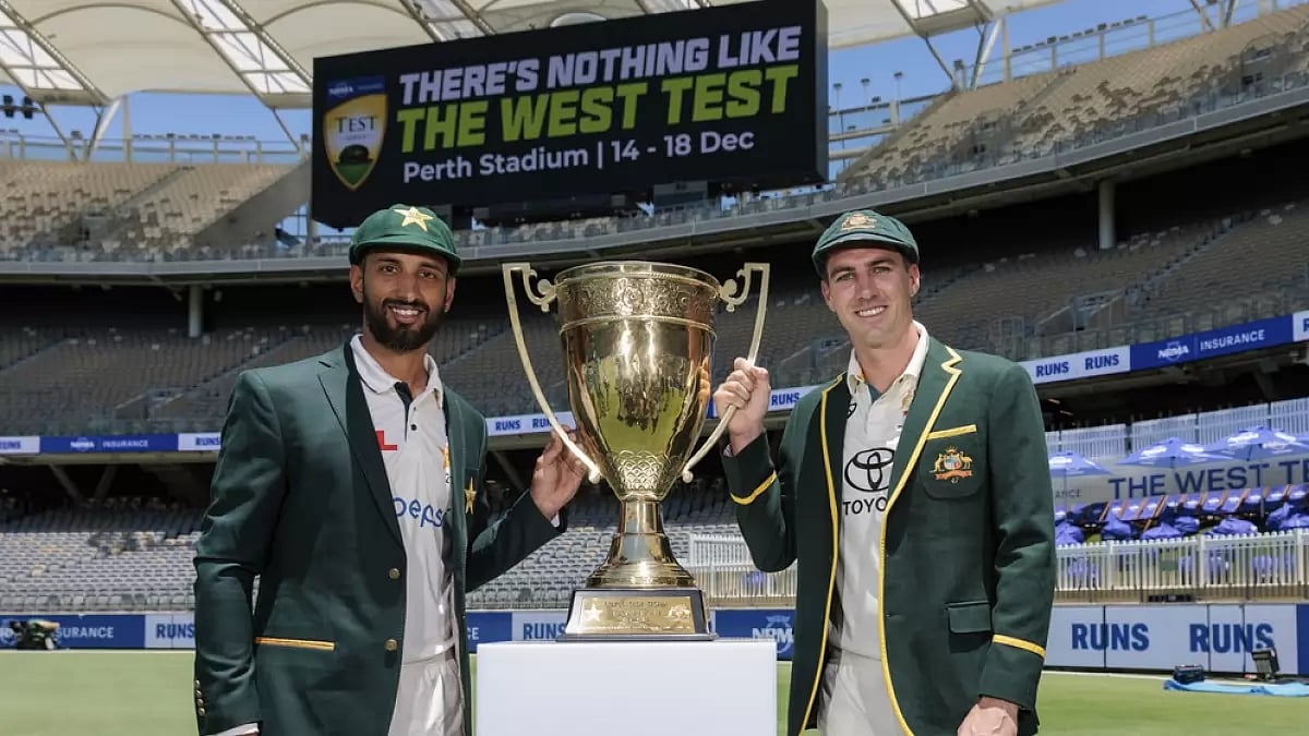Pakistan skipper Shan Masood (left) poses with the trophy alongside Pat Cummins of Australia